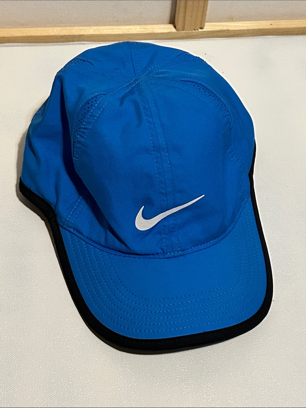 Nike Bright Blue Cap with White Swoosh and Black Trim